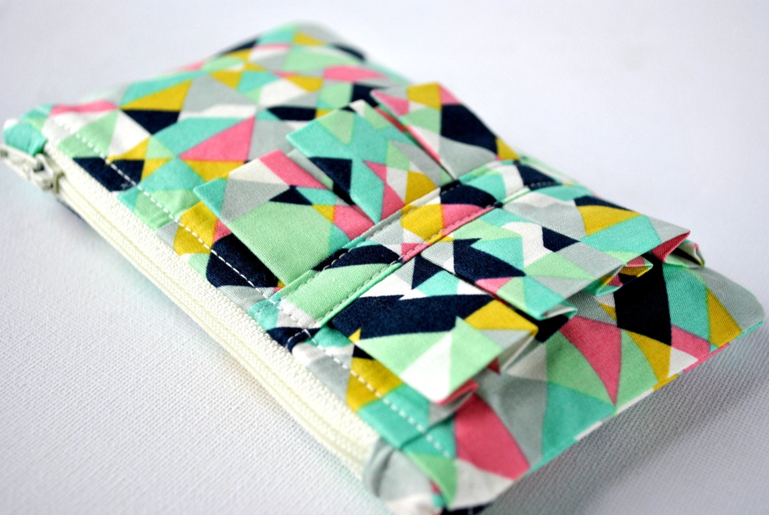 Coin purse wallet: Abstract triangle shapes print in pink, aqua blue,yellow and navy blue with ruffle.