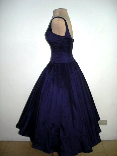 A sexy yet elegant 50s style cocktail dress in gorgeous deep blue satin