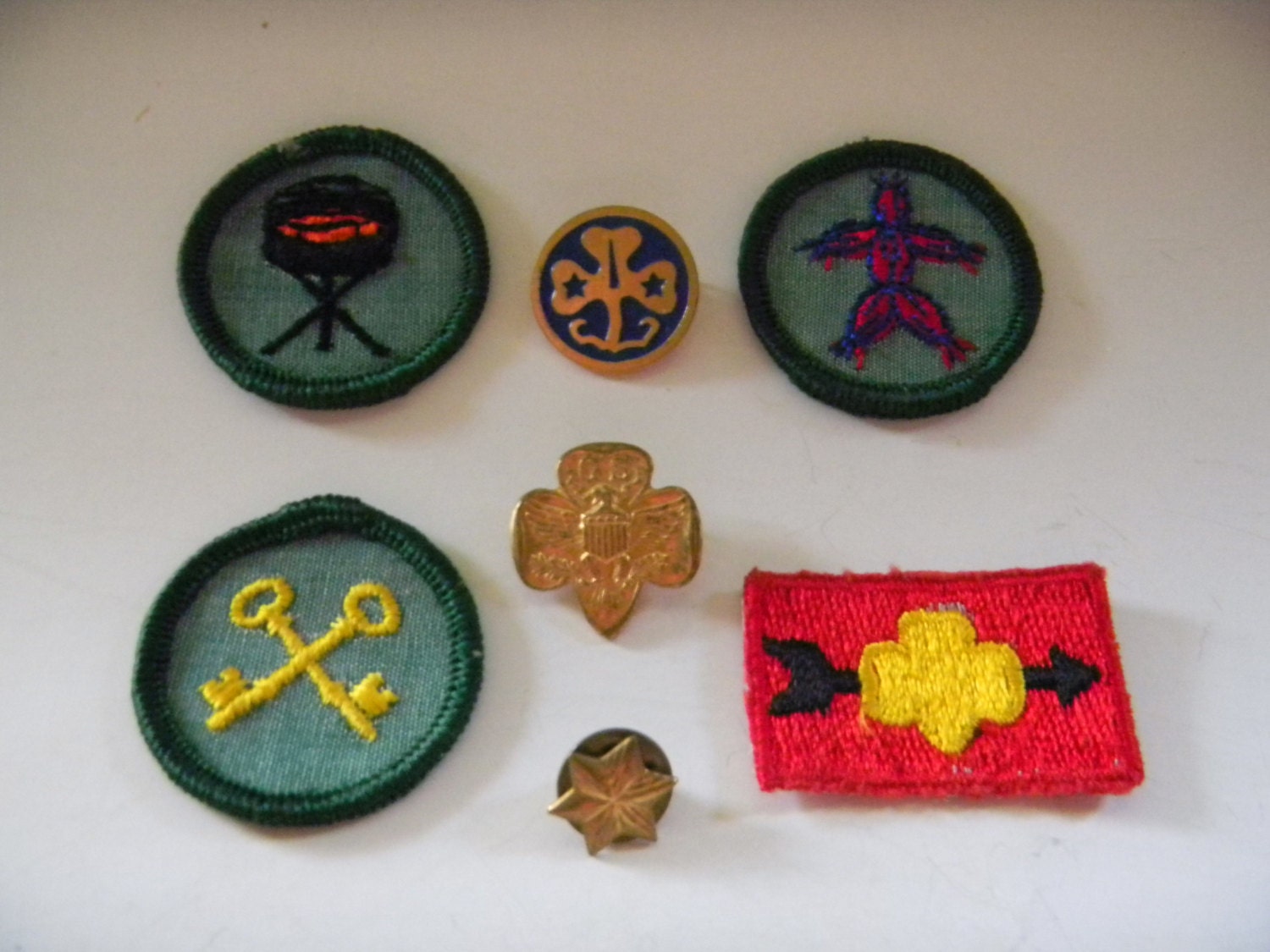 Collection of vintage 60s/early 70s Girl Scout pins and badges..