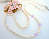 Long freshwater Pearl necklace with Swarovski butterflies.