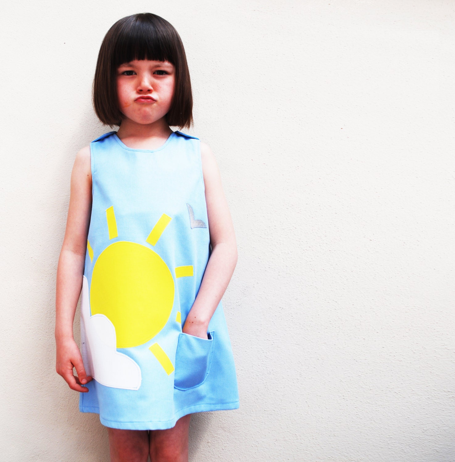 Girls handmade dress with summer sunshine and cloud