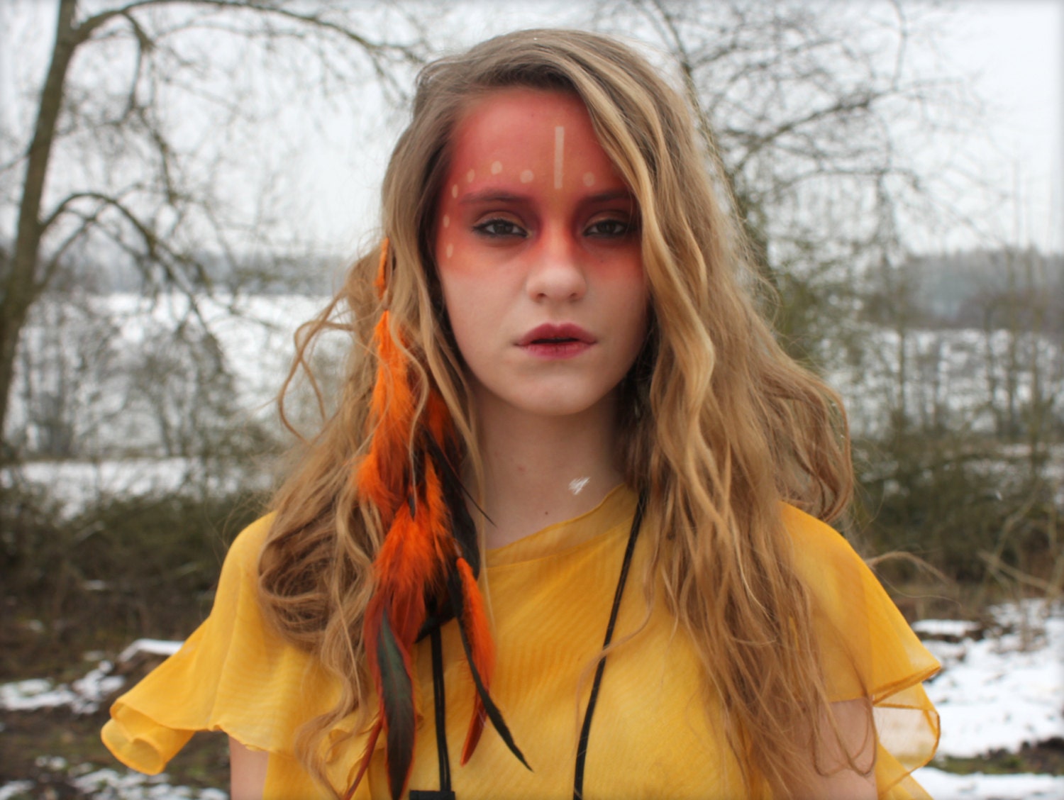 Orange feather and leather extension clip