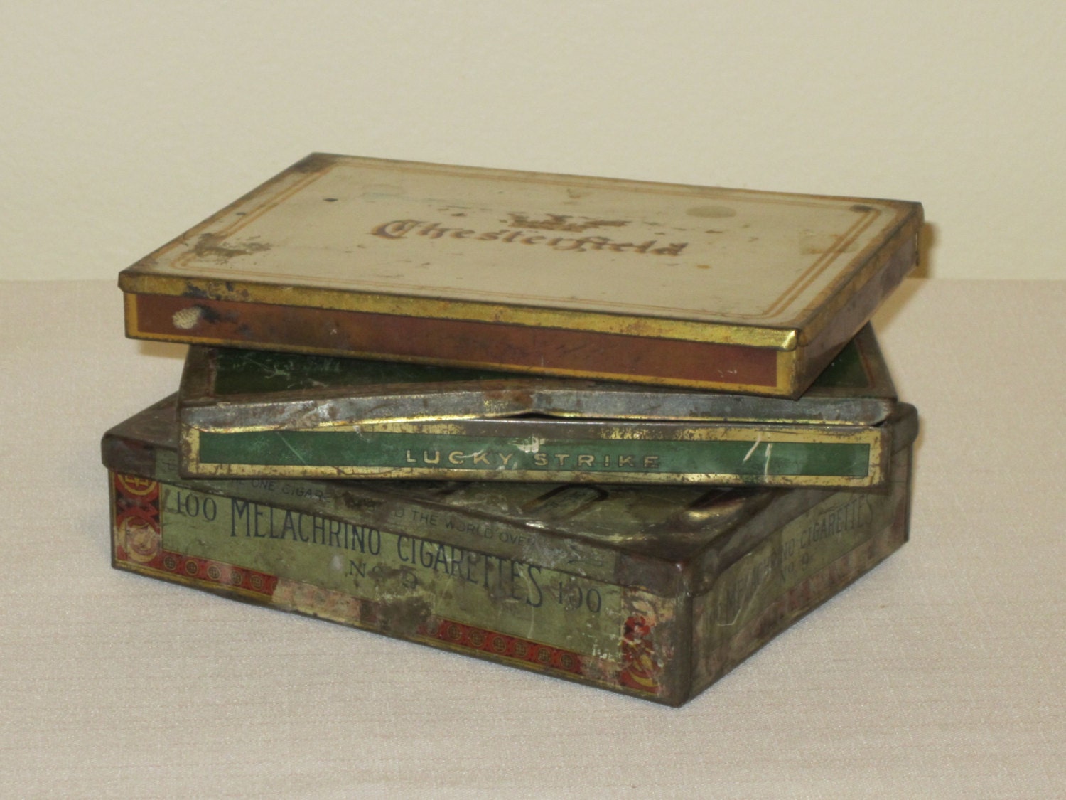 3 Tin Cigarette Boxes Lucky Strikes and Melachrino and Chesterfield