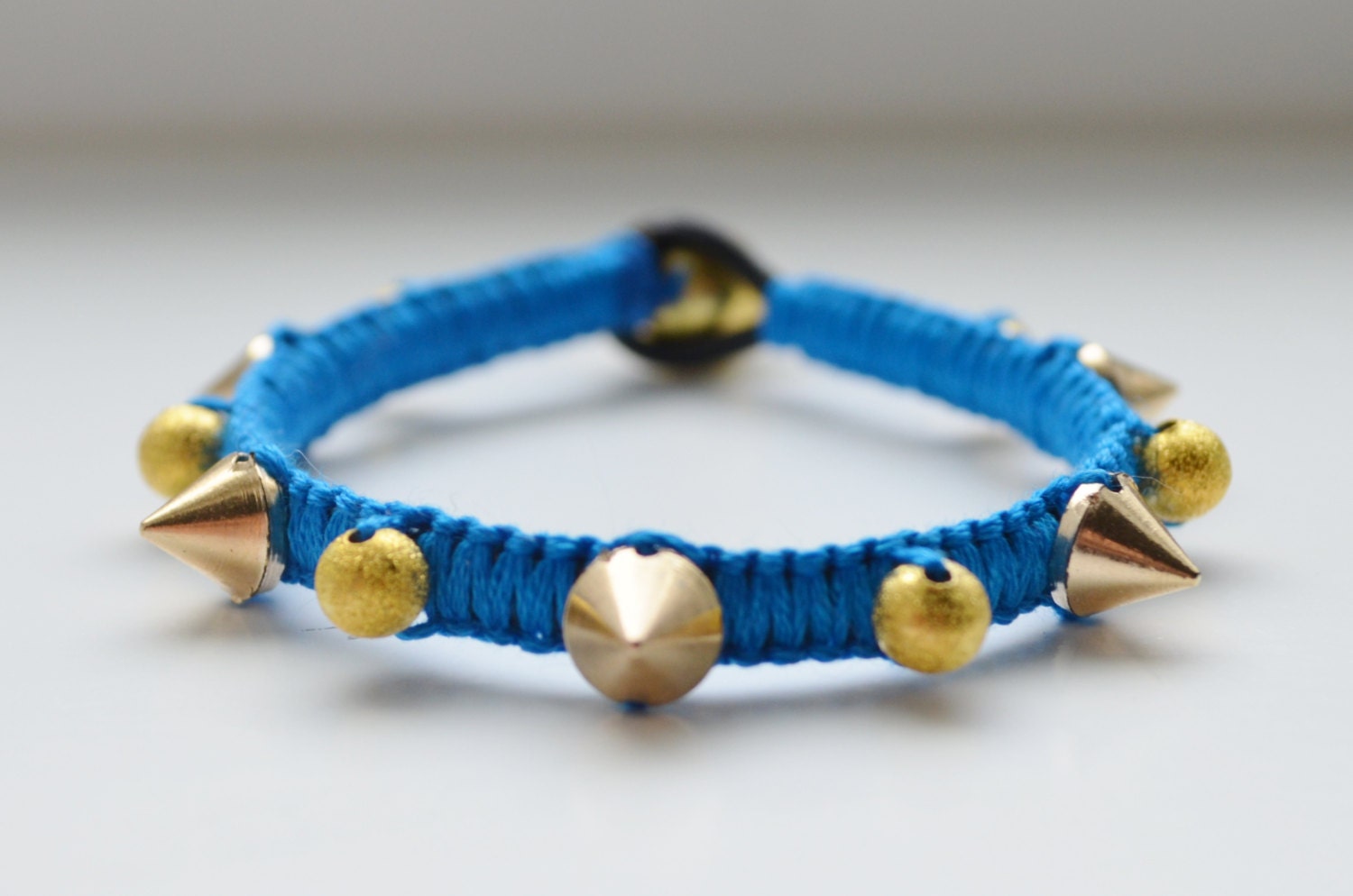 Bright blue and gold spike bracelet