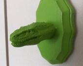 green faux taxidermy Giganotosaurus dinosaur head