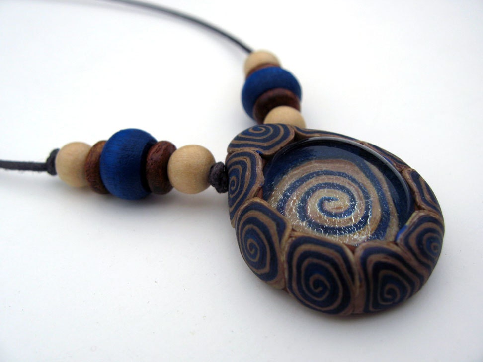Mens pendant necklace with tribal spirals in polymer clay and glass, handmade teardrop pendant with wood beads on thin cord