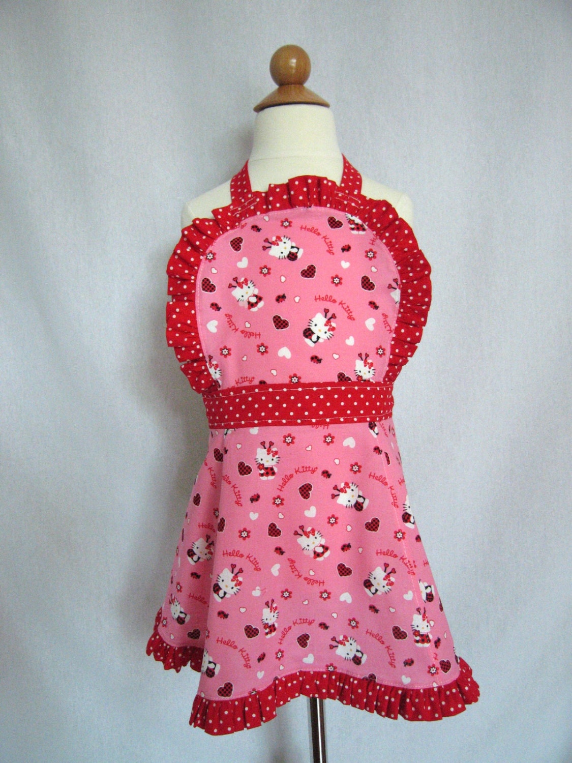 Little Girl's Hello Kitty Ruffled Apron with Lady Bugs in Pink