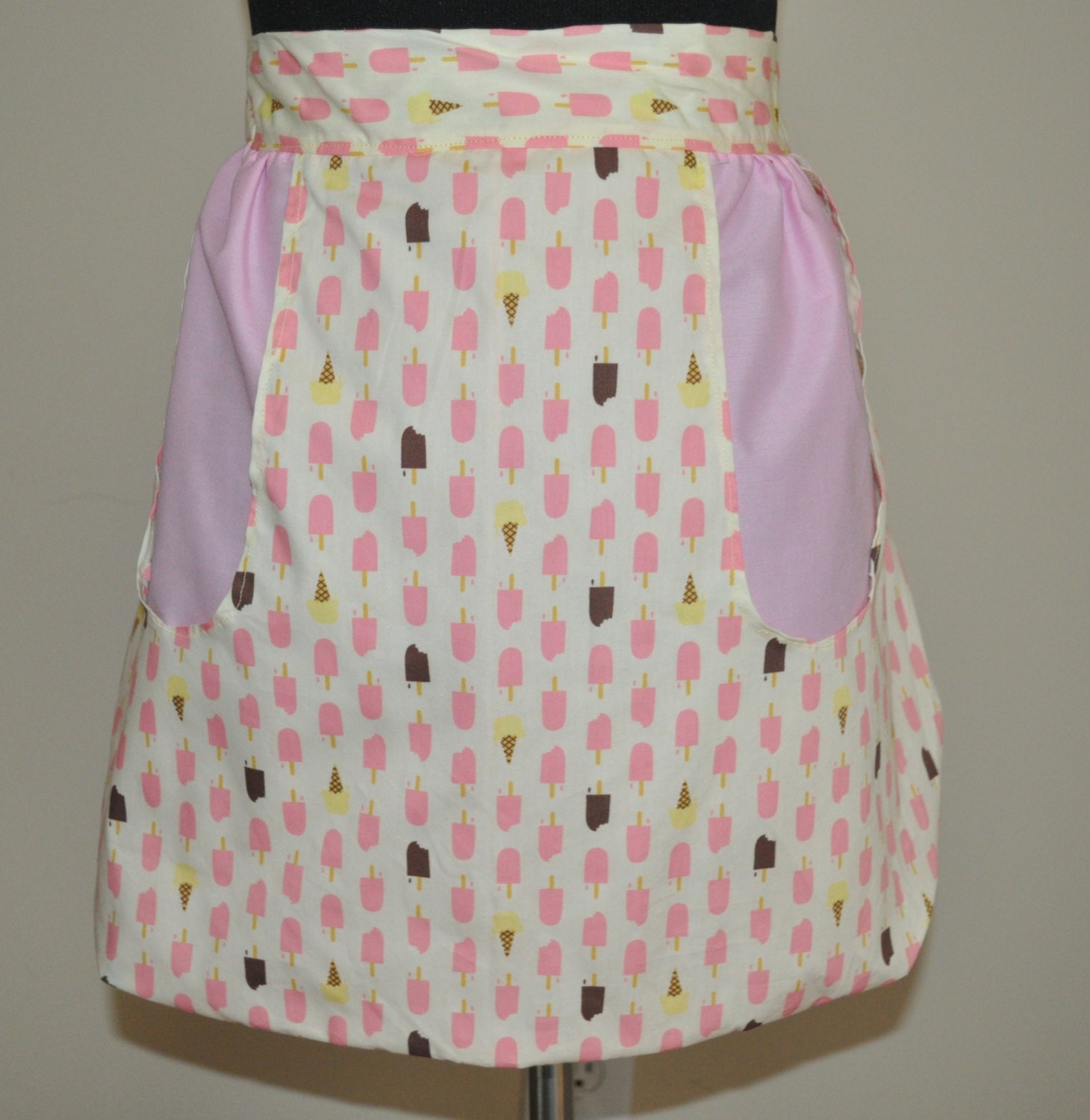 Womens half apron in Ice cream bars and chocolate bars with large pocket.  Ready to ship.