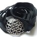Silk wrap bracelet with silver medallion center.