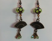 Long root beer brown and green polka dot fan dangle earrings, antique brass fan and crystal earrings