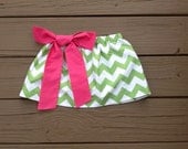 Girls twirly skirt & hot pink fabric bow. Mod green white chevron. Custom boutique children's clothing. By EverythingSorella.