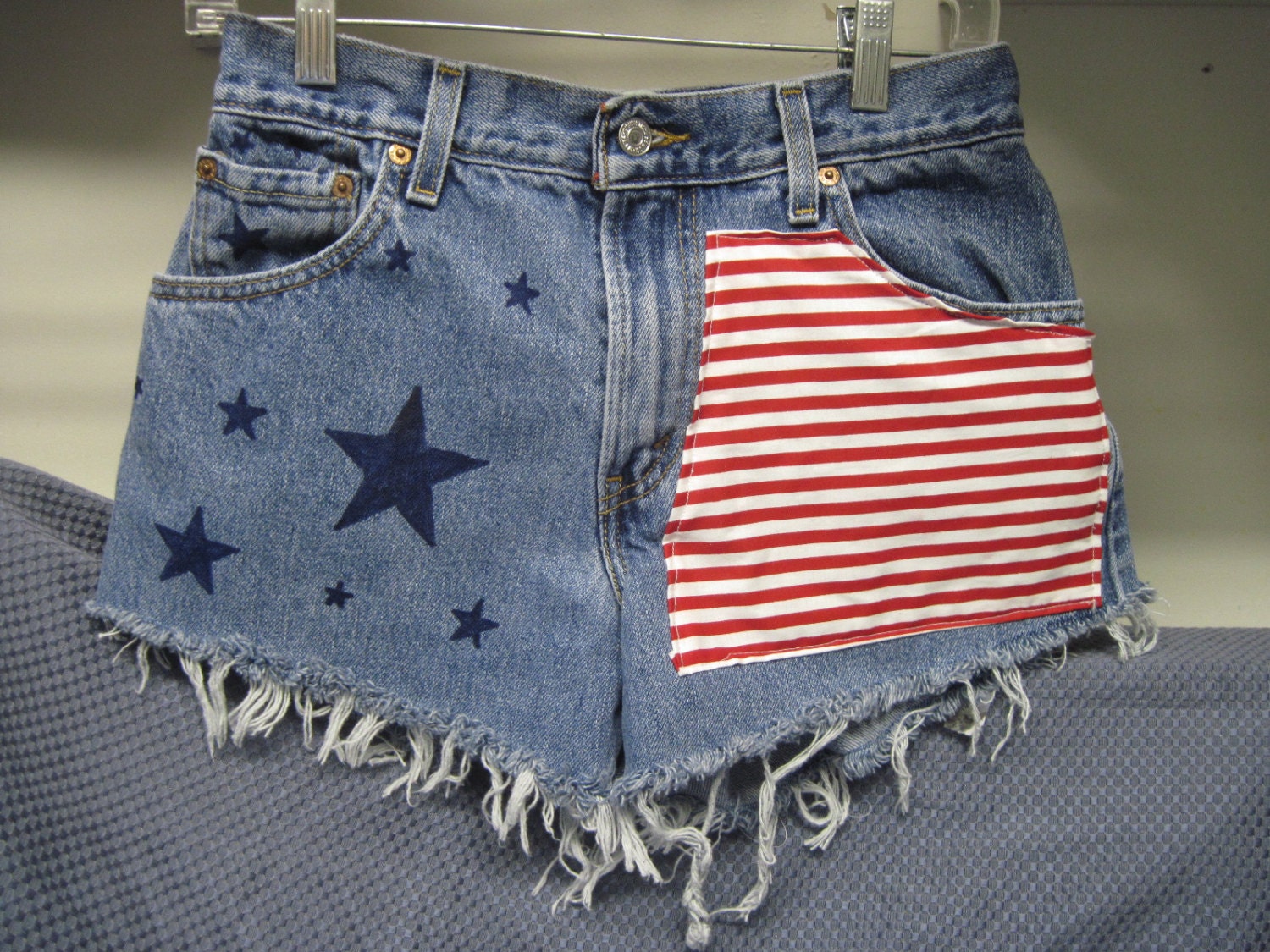 AWSOME Vintage Levis 505 denim cut off shorts size 6 waist  29 inches frayed ripped  High Waisted  stars and stripes with silver star studs
