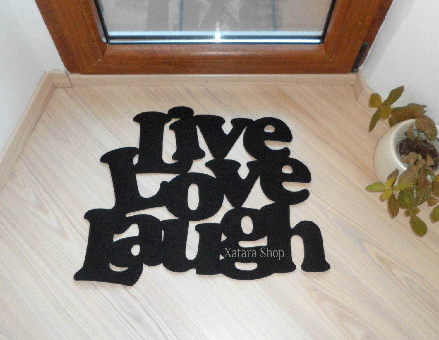 Live love laugh. Door mat with a personalized message in black