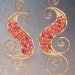 Luxe Bijoux 128 Hammered swirl shapes wrapped with ruby and carnelian