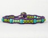 Purple cord bracelet. Turquoise aqua, mint green, lime green glass beads.  Silver button. Friendship bracelet.