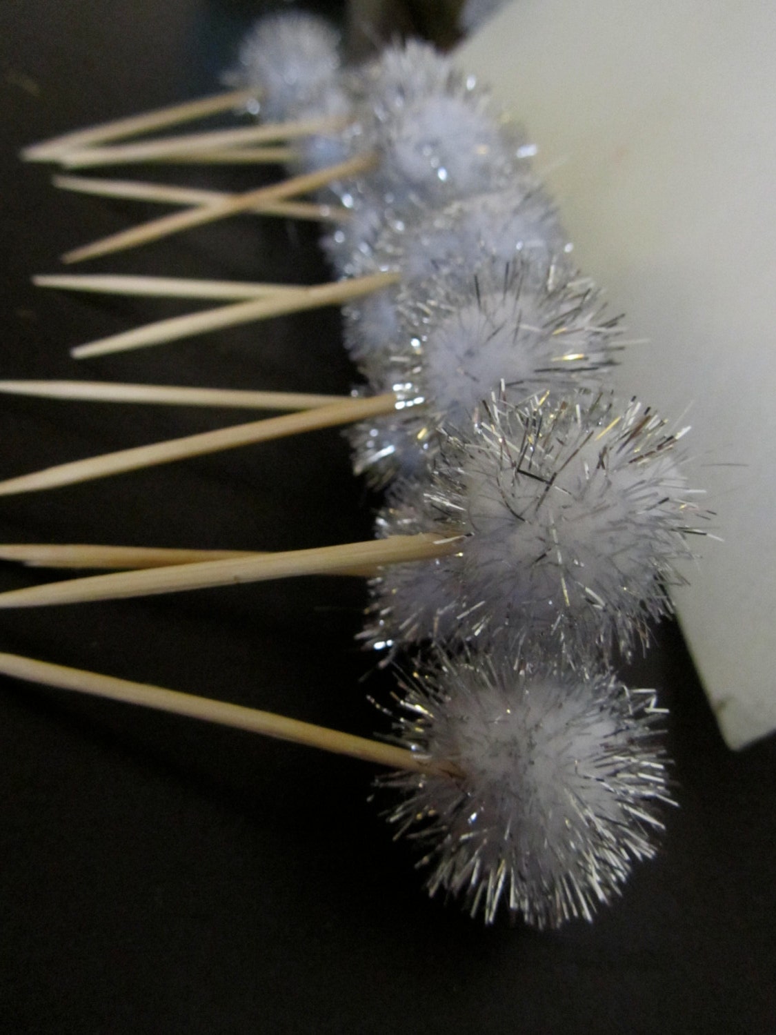12 silver pom pom party picks