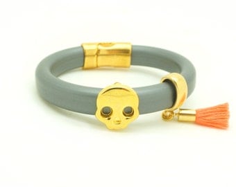Gold Skull Bracelet - Gray Rubber Cord w/ Nectarine Coral Tassel & Magnetic Closure