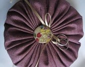 The Wedding Pouf- Ring Bearer Pillow in Purple Linen with Floral Iridescent Button and Gold Satin Ribbon