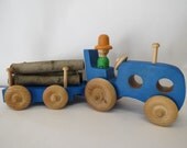 Toy tractor with wooden trailer