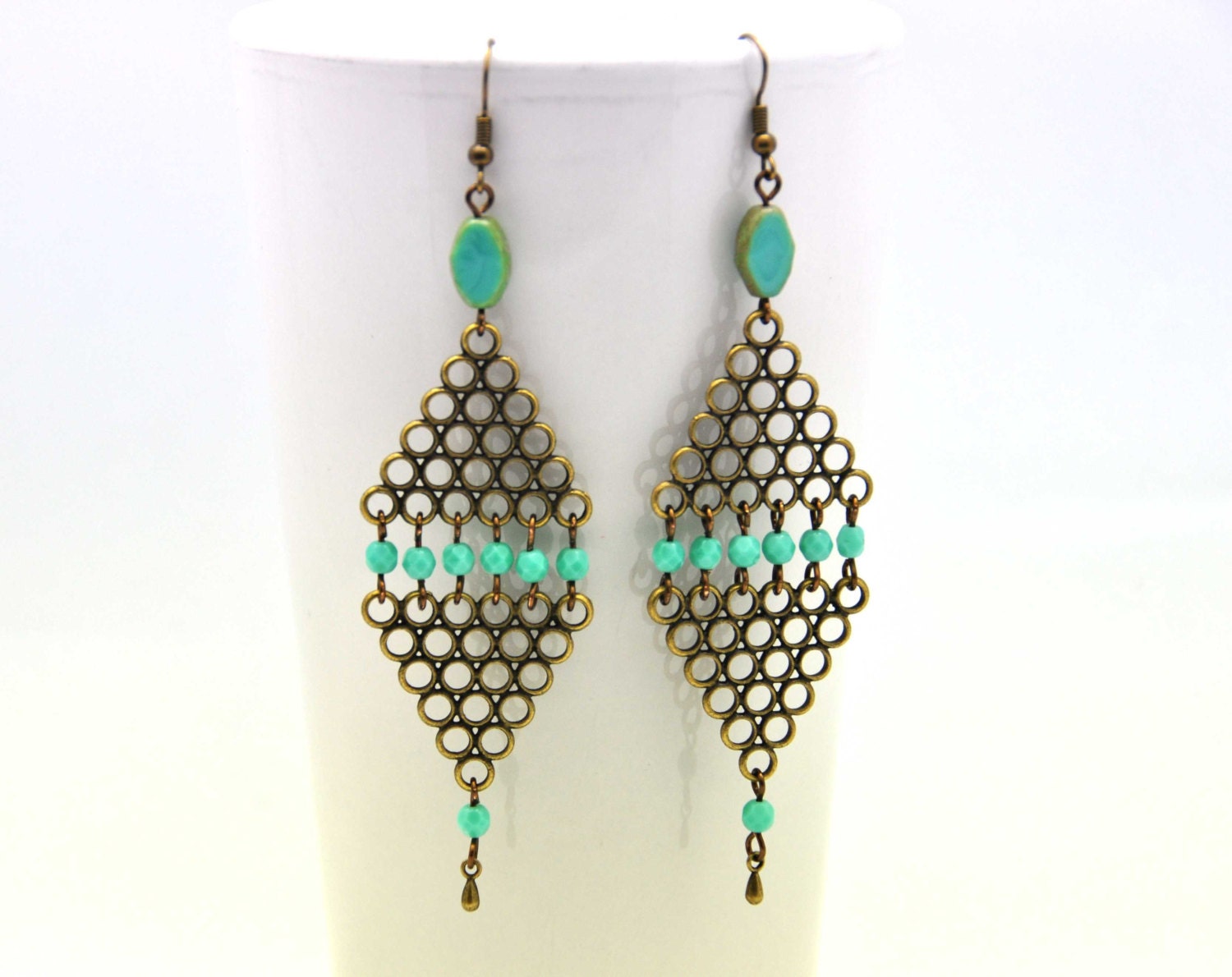 Losange earrings made with aqua, turquoise faceted czech crystal beads and antiqued brass triangular filigrees