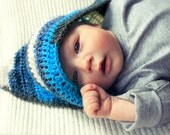 Crocheted hooded striped blue baby blanket