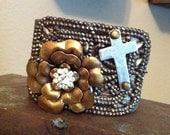Leather cuff bracelet with vintage buckle, metal flower and cross