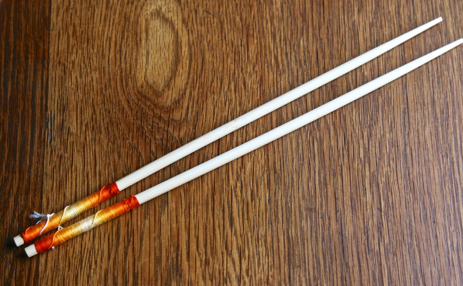 Hand decorated pair of long cooking bamboo chopsticks by Flower Power Nation