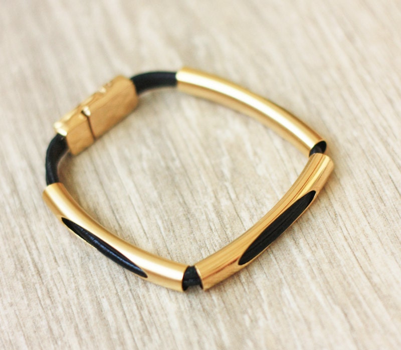 Handmade black leather bracelet, elegant design with gold tubes and a gold magnetic clasp. Elegant, and delicate.
