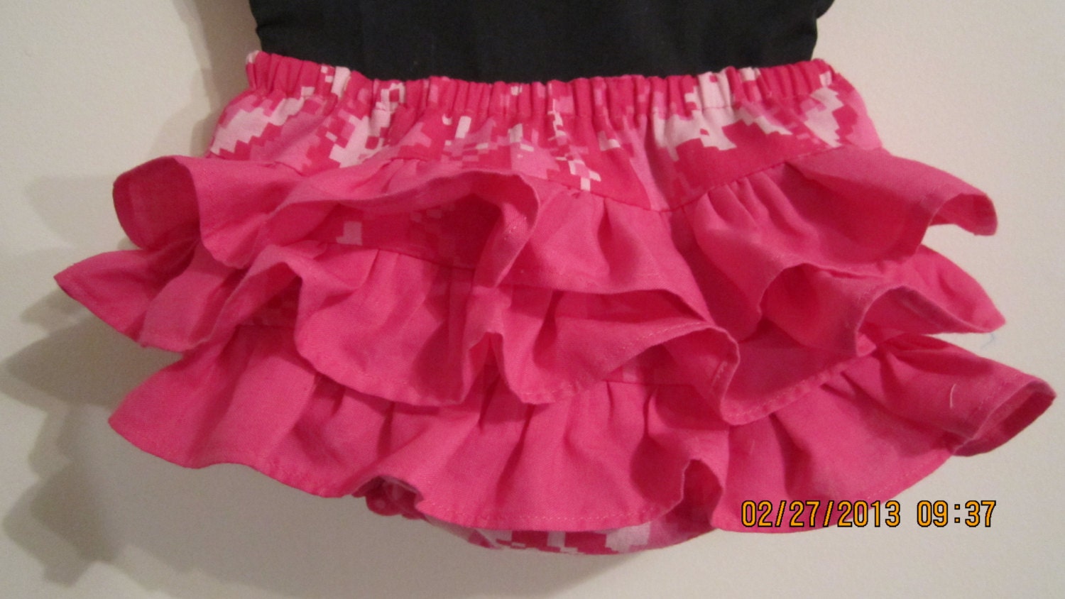 Girls ruffled baby bumper, diaper cover made with hot pink digital military fabric, with coordinating lily headband.