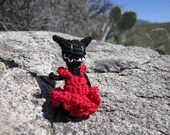 Tiny Black Cat with Red Dress