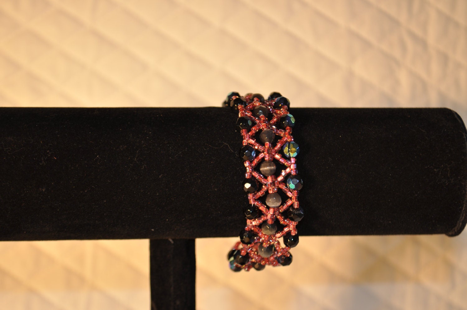 Gray cats eye and black AB finished swarkovski beads and pink beaded bracelet.