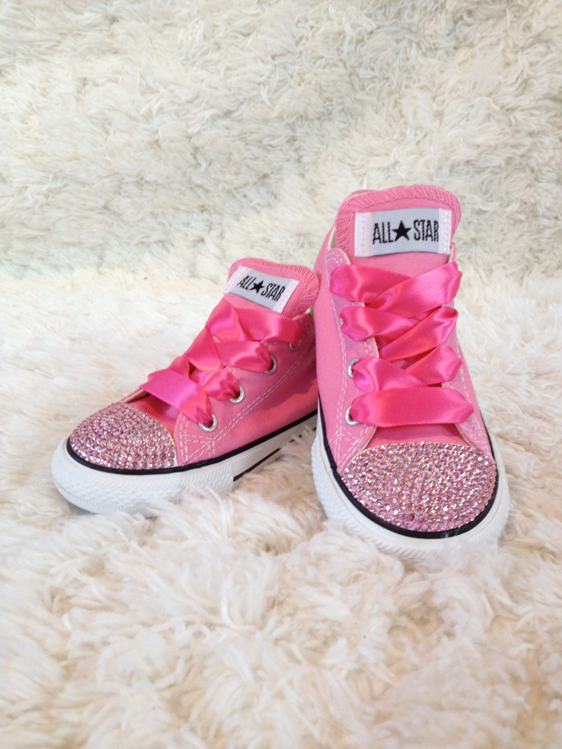 Adorable pink bling'd out converse shoes with pink rhinestones. Infant and toddler sizes.