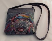 Gray shoulder bag with hand felted motif.