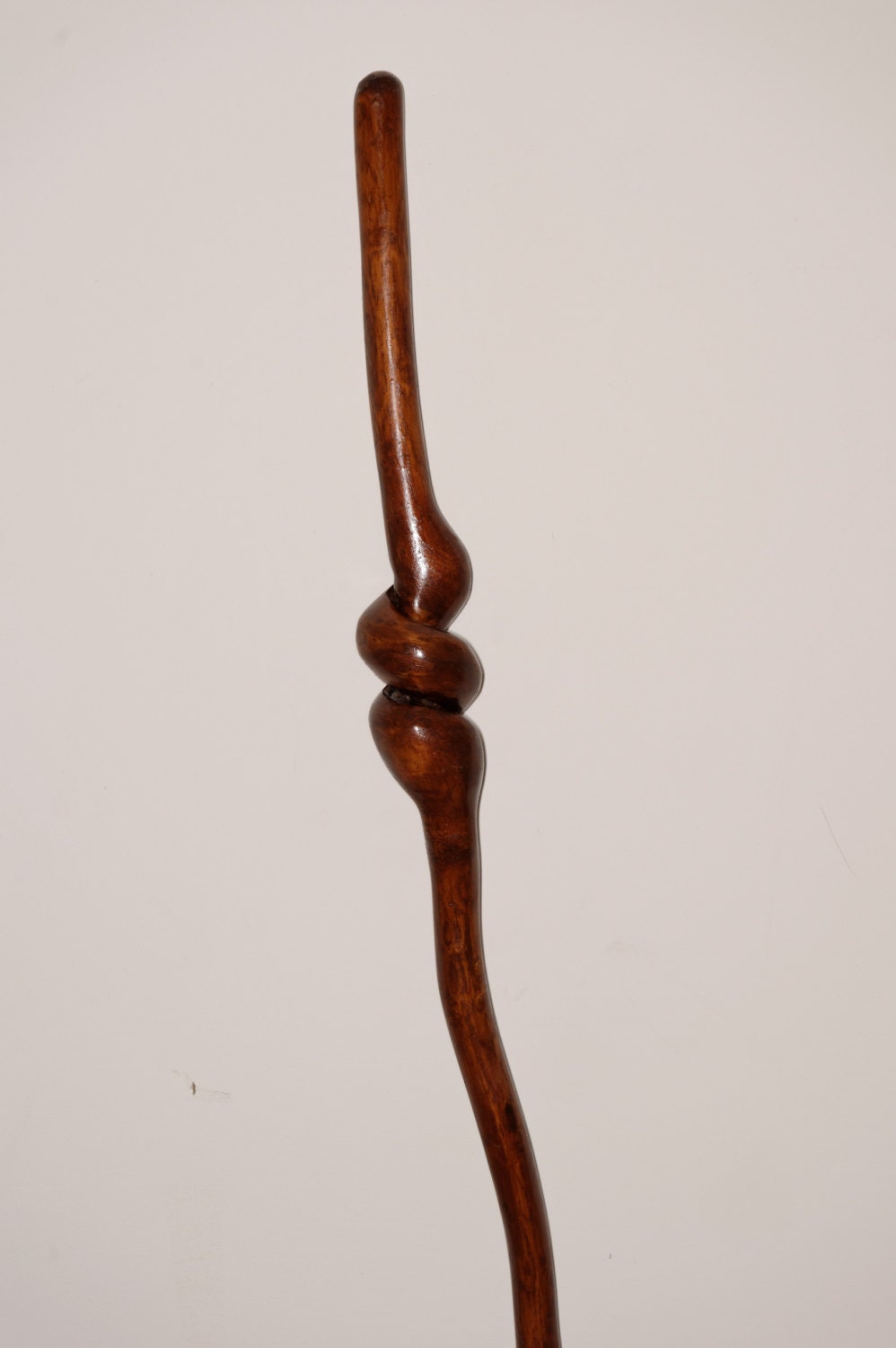 natural twist hardwood staff, burnt umber in color