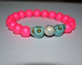 Neon Swarovski pearl bracelets adorned with Swarovski pave & skull beads