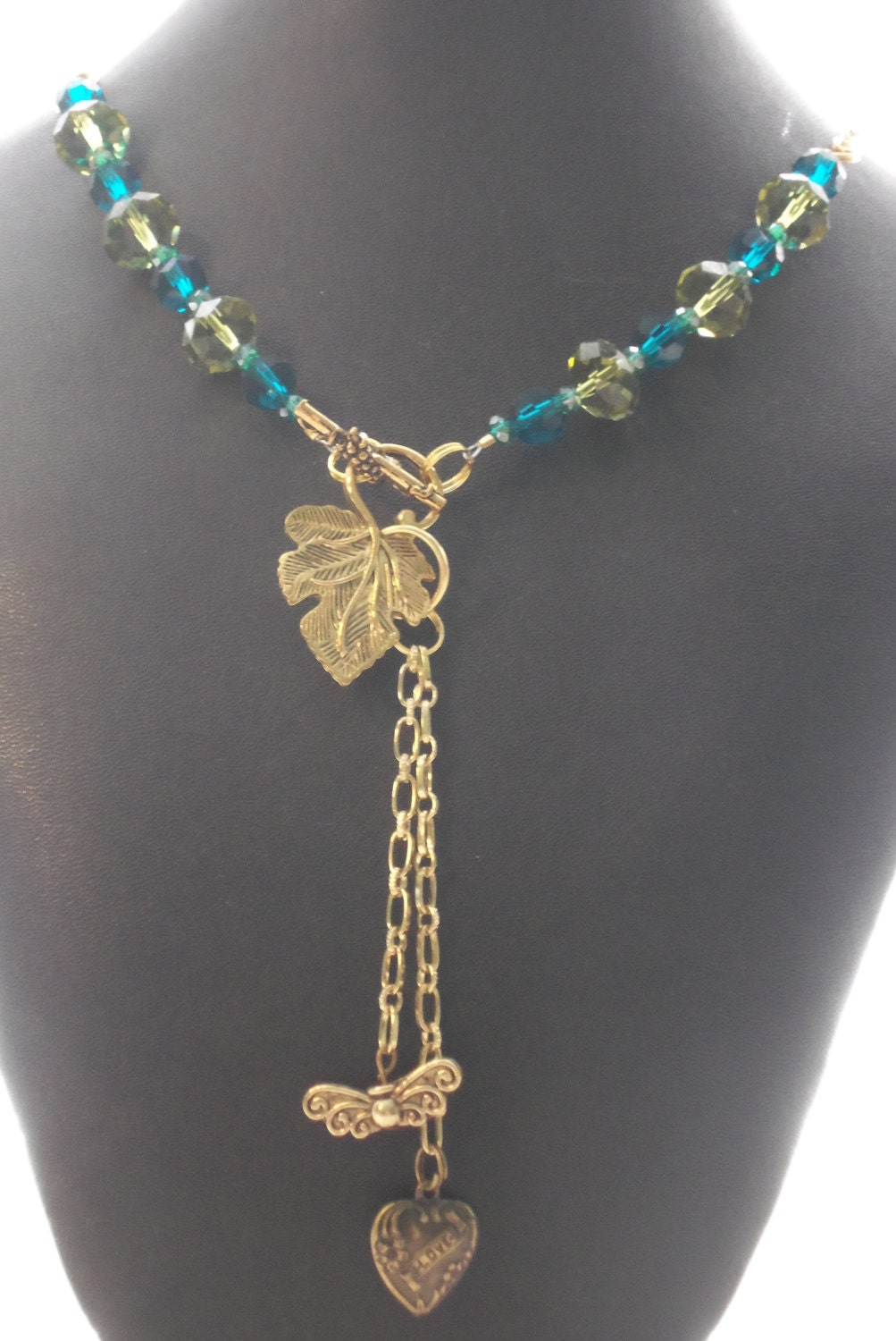 sparkling green and aqua beads with gold toned metal chain and toggle closure