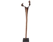 Unique wonderfully organic handmade sculpture featuring a lacquered palm leaf mounted on a black metal stand