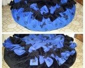 Marshmallow Pet Bed in plush black with blue and black bone print