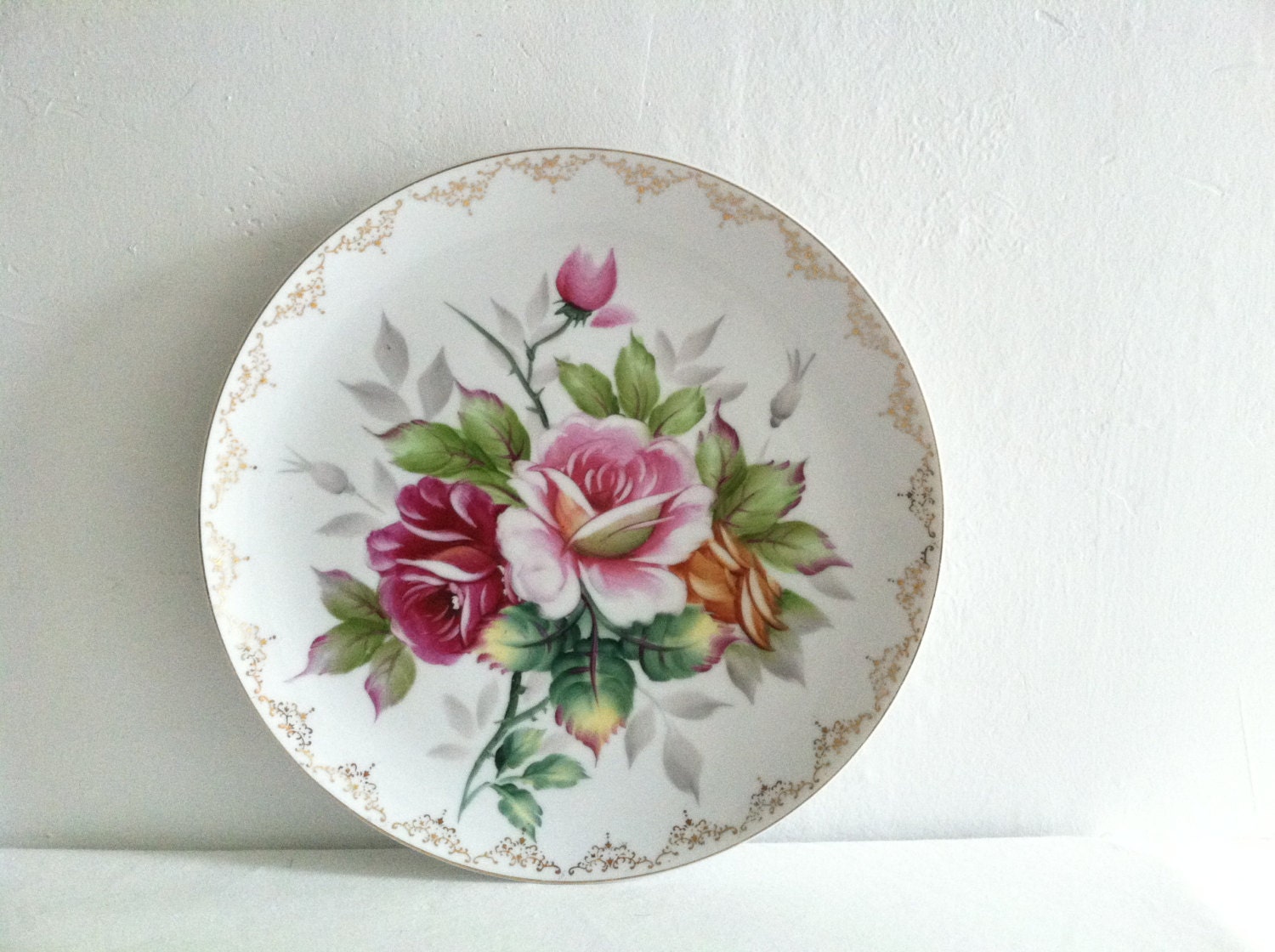 antique floral wall plate with gold trim