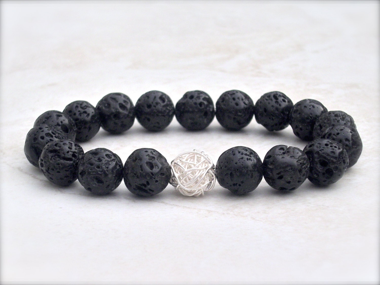 Black lava bracelet with handcrafted sterling silver, stretch stack yoga style, round