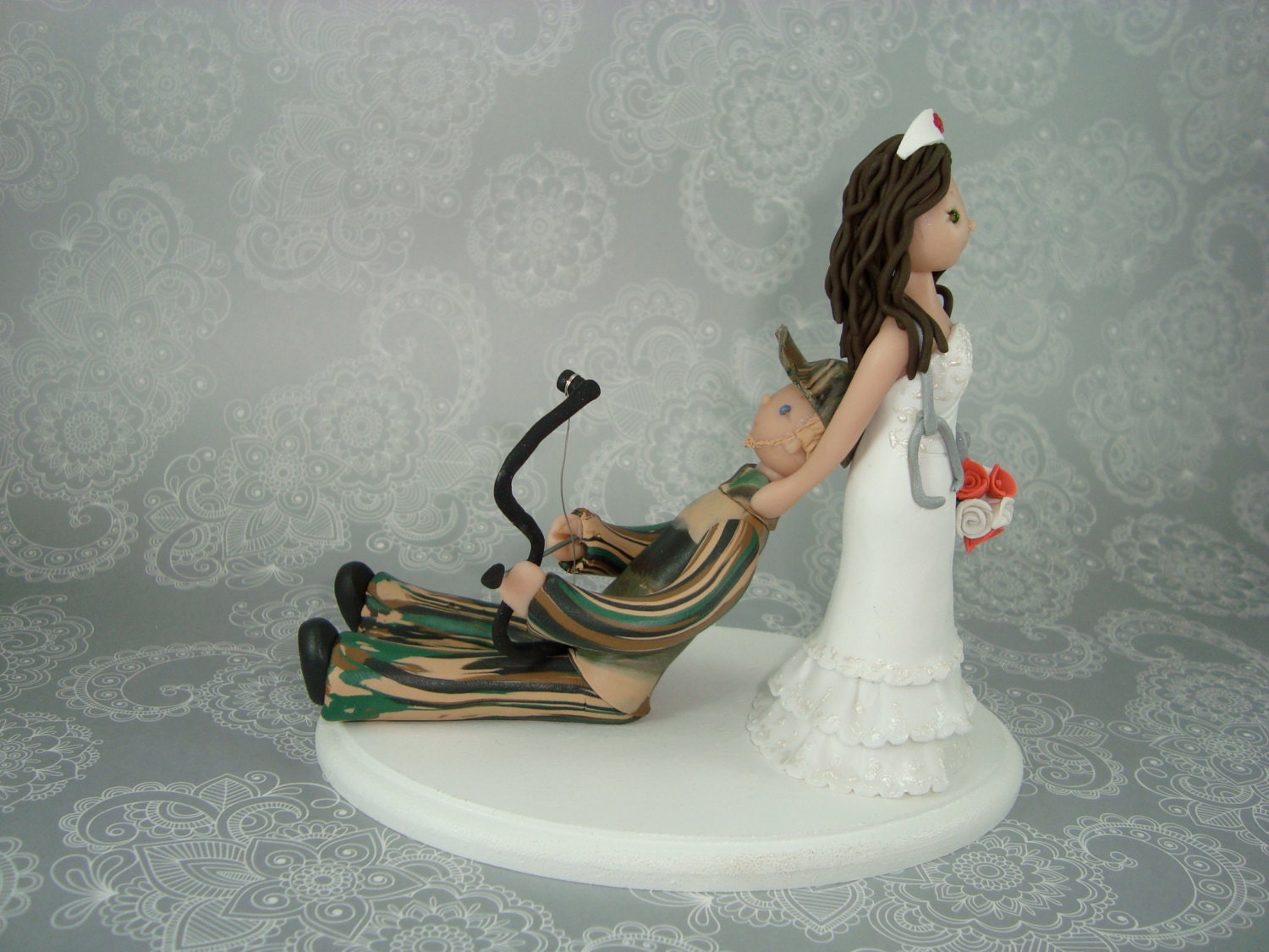 Nurse Dragging Hunter Personalized Wedding Cake Topper