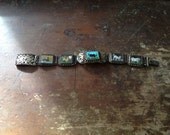 Chinese zodiac / enameled panels / a filigree bracelet