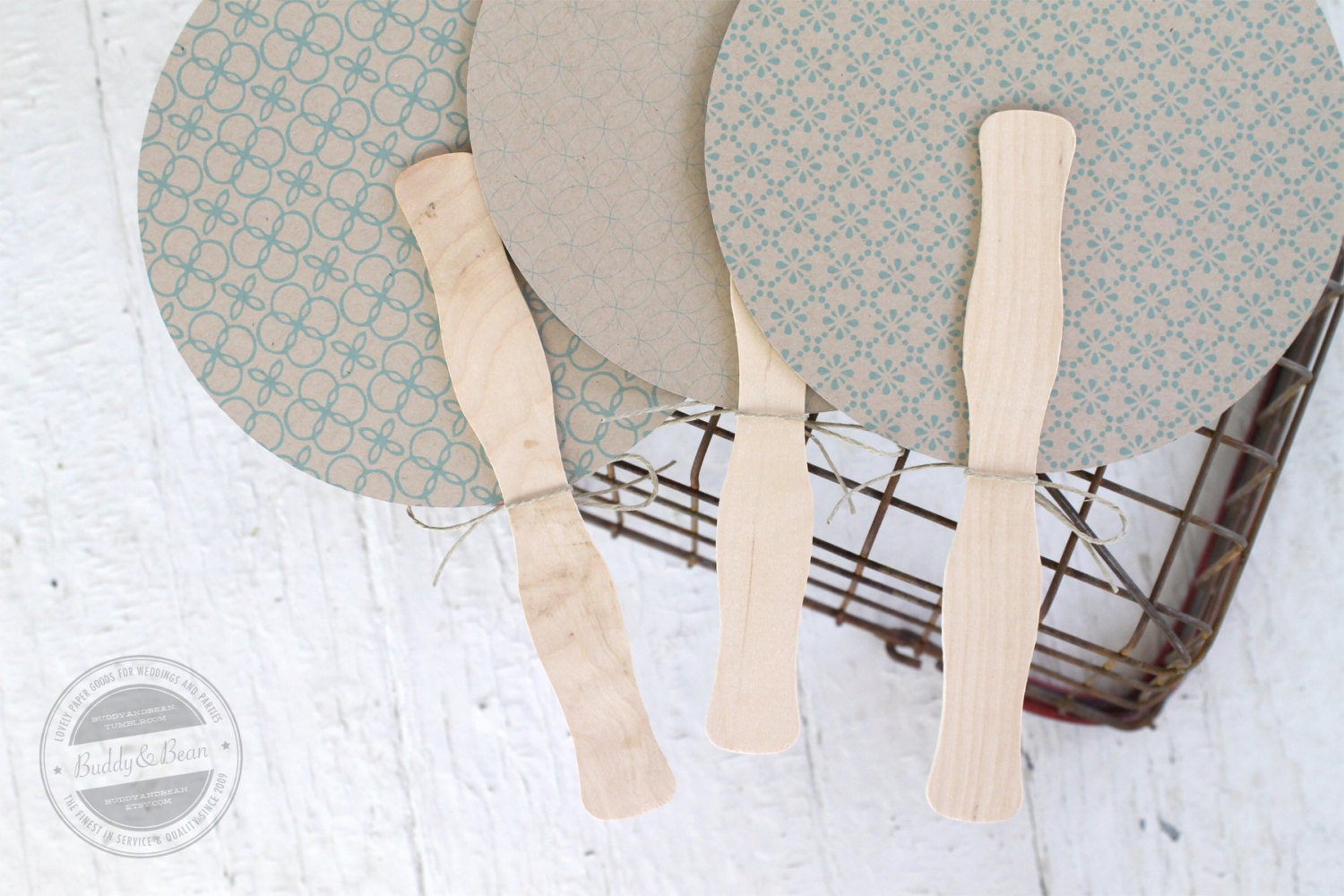 Round program fan. 3 patterns. sky blue on kraft
