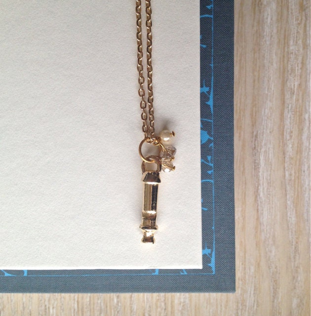 Whistling Winds Gold Charm Necklace