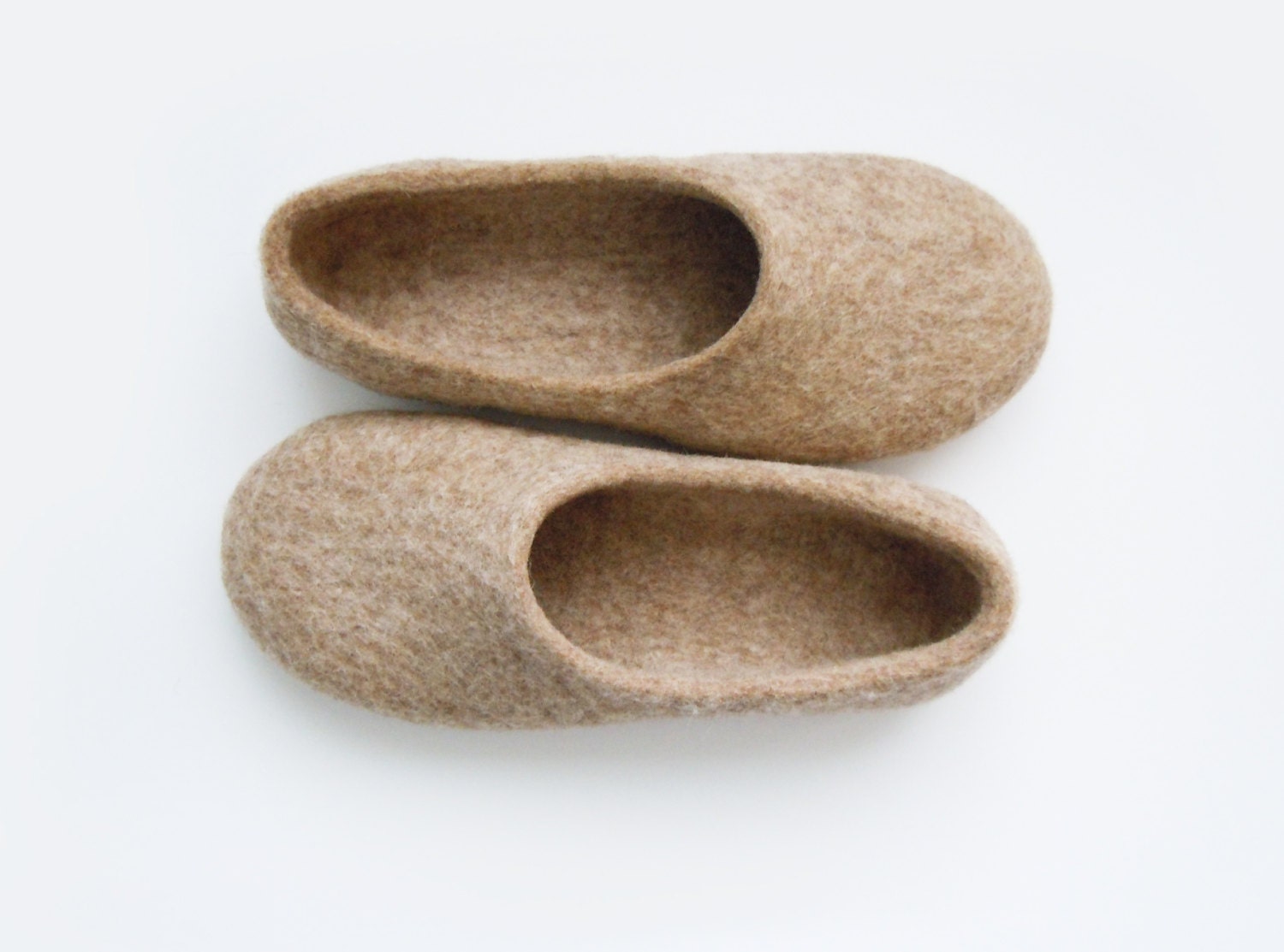 Eco friendly handmade felted slippers in natural light brown color.