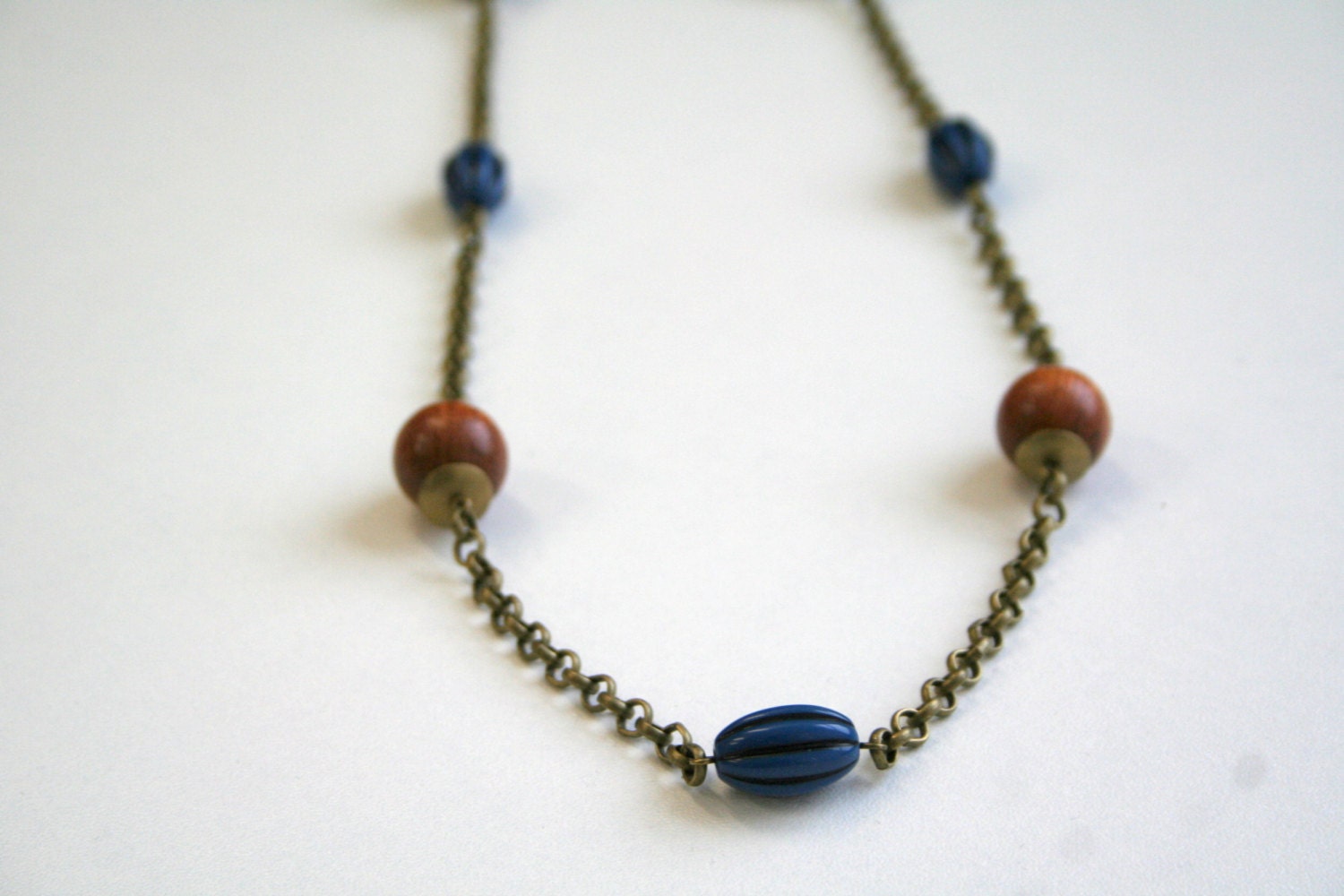 Wood and vintage beads necklace, long necklace, blue black beads, natural wood, brass finish