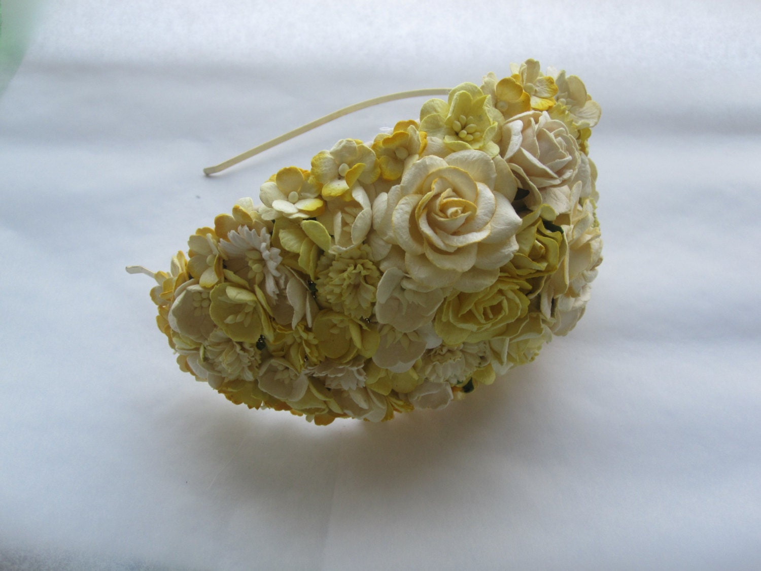 Bright yellow flower headpiece. For wedding, ascot or mother of the bride