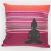 Colorful applique buddha pillow with fuchsia stripes, made from eco-friendly recycled fabric
