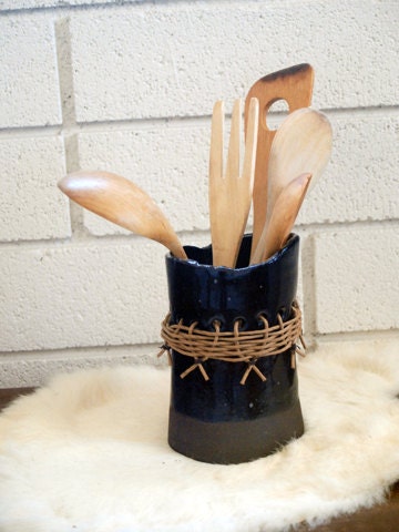 small black utensil pot