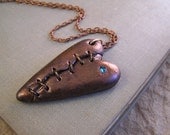Steampunk broken heart pendant. Copper with blue swarovski crystal, victorian style